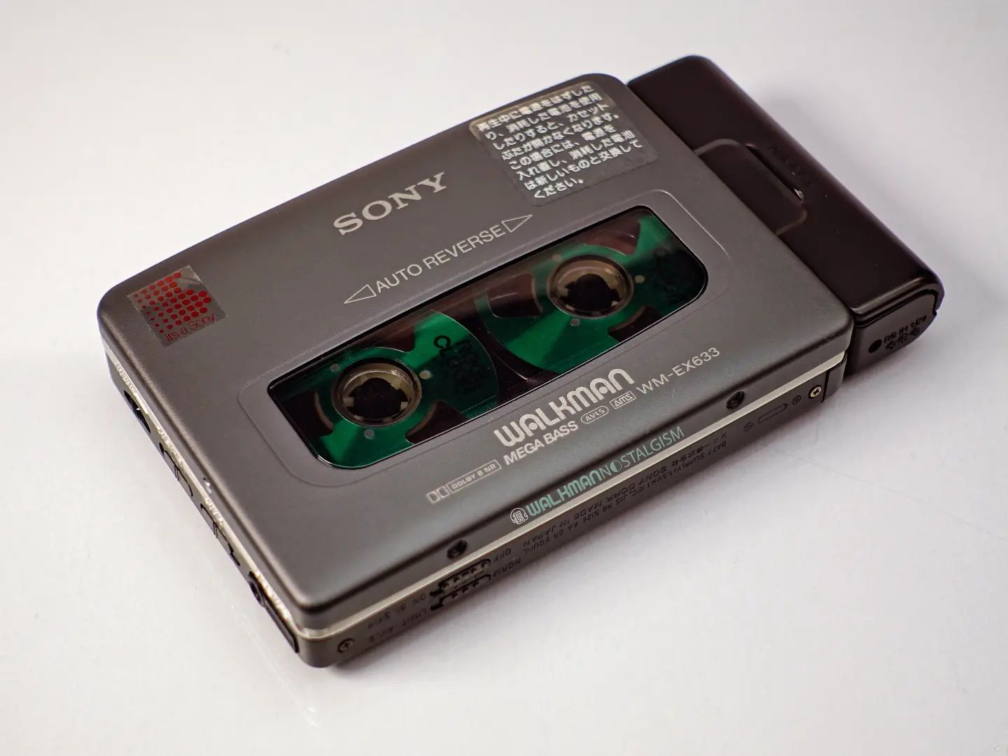 Sony_WM-EX633_-_Angled_front_with_cassette_and_sidecar_lying_flat_ig-walkmannostalgism